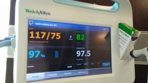 A screen with my blood pressure, heart rate, oxygen levels, and temperature.